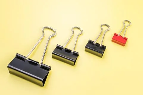 Group of different clips with one highlighted red clip. Stock Photos