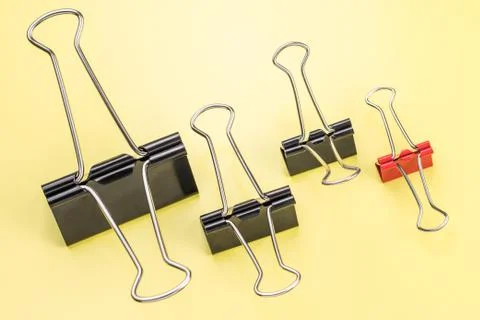 Group of different clips with one highlighted red clip. Stock Photos