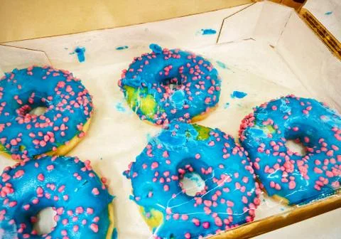 A group of different colored doughnut. Mobile photo. Stock Photos