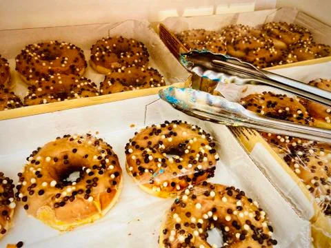 A group of different colored doughnut. Mobile photo. Stock Photos