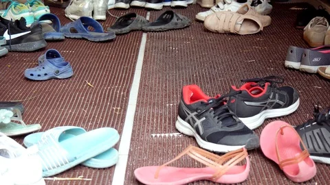 Group Of Different Shoes On The Floor Stock Footage 127709373