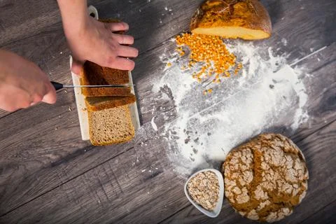 Group of different types of bread on old wooden table Stock Photos