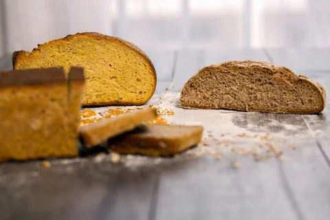 Group of different types of bread on old wooden table Stock Photos