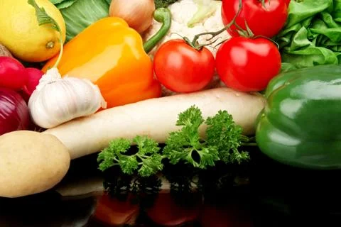 Group of different vegetables on black background Stock Photos