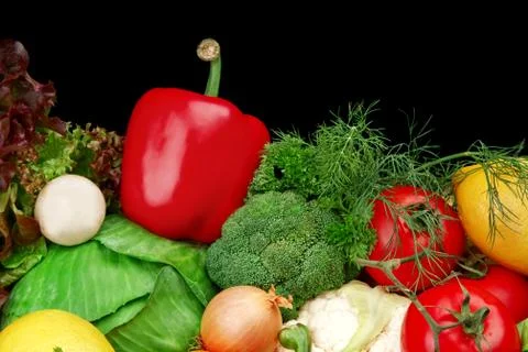 Group of different vegetables on black background Stock Photos