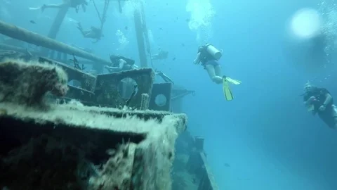 Group of Divers Explore A Sunken Ship Stock-Footage 75798682