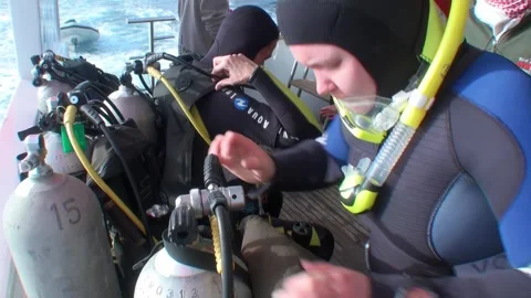 Group of divers prepare their gear for dive. Stock Footage 263836055