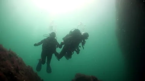 Group of divers underwater on decompression in Atlantic ocean. Stock Footage 142730772