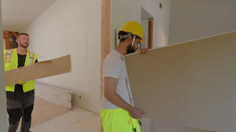 A Group of Diverse Builders Collaborating Effectively on a House Renovation Stock Footage 305443368