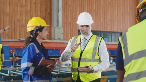 Group of diverse engineering and worker working together and discussing wit.. Stock Footage 242714295