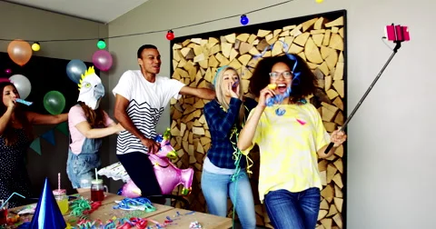 Group of diverse friends dancing around in a home Stock Footage 68205760