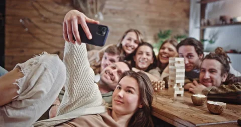 Group of diverse friends posing for a selfie on a mobile phone. Group of happy Stock Footage 172556115