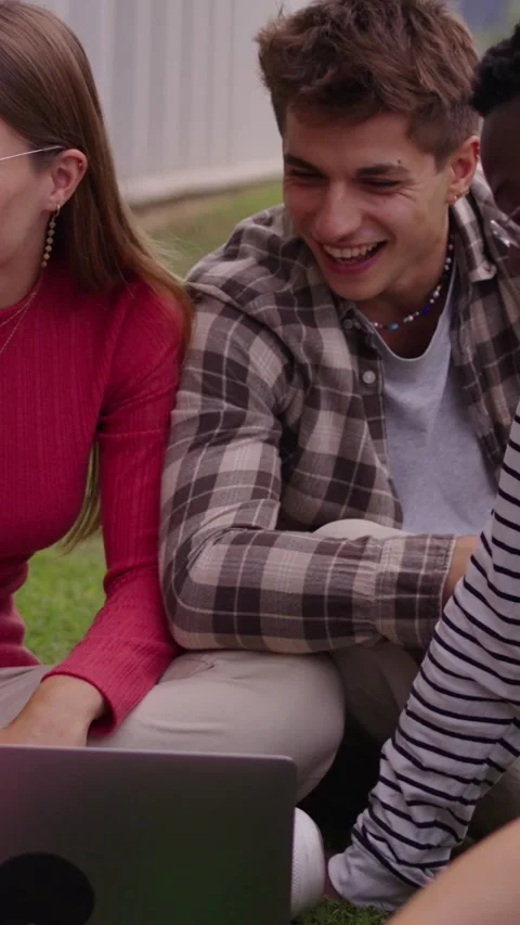 Group of diverse multiethnic smiling young students using laptop studying Stock Footage 275428489