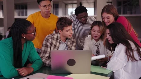 Group of diverse multiethnic smiling young students using laptop studying Stock Footage 275428712