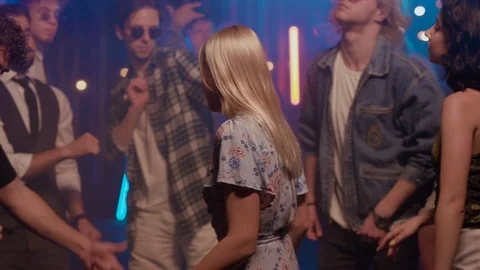 Group of diverse nice looking young peple dancing at party with focus on Video stock 114933522
