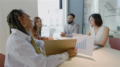 A Group of Diverse Professionals Working Together in a Contemporary Office Stock Footage 305491257