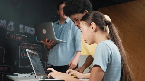 Group of diverse smart student working together to write program. Edification Stock Footage 265030332