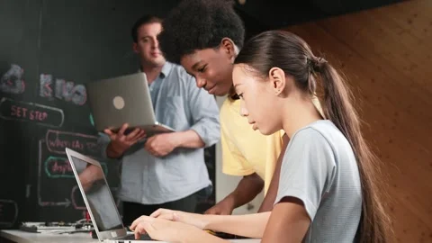 Group of diverse smart student working together to write program. Edification Stock Footage 273173686