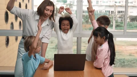A group of diverse student and teacher celebrate successful project. Erudition. Stock Footage 283223780