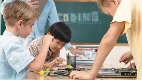 Group of diverse student working together while teacher hold tablet. Pedagogy. Stock Footage 267469065