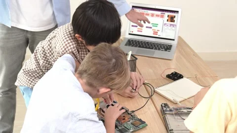 Group of diverse student working together while teacher hold tablet. Pedagogy. Stock Footage 270176996