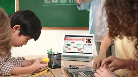 Group of diverse student working together while teacher hold tablet. Pedagogy. Stock Footage 270402731