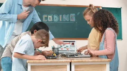 Group of diverse student working together while teacher hold tablet. Pedagogy. Stock Footage 273102992