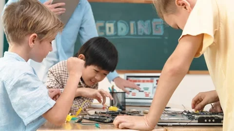 Group of diverse student working together while teacher hold tablet. Pedagogy. Stock Footage 275415913