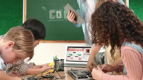 Group of diverse student working together while teacher hold tablet. Pedagogy. Stock Footage 278291193