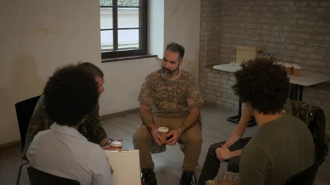 Group of diverse veterans talking during PTSD support group. Stock Footage 229630336
