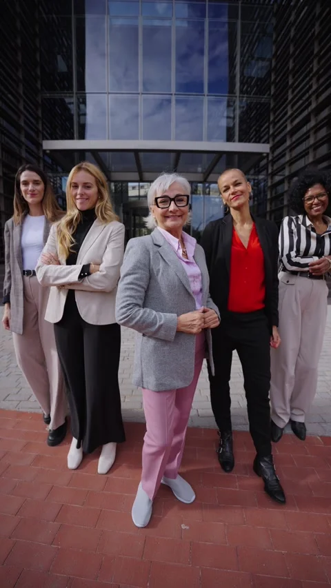 Group of diverse women step forward together looking smiling at camera, arms Stock Footage 316988017