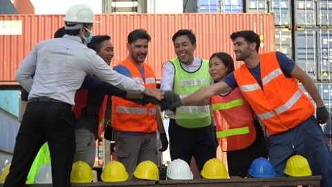 Group of diverse worker putting their hands Joining and raised hands sign of Stock Footage 139095930