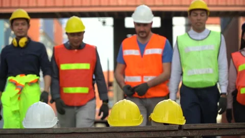 Group of diverse worker Take off safety helmet and walking out to finish work Stock Footage 140277620