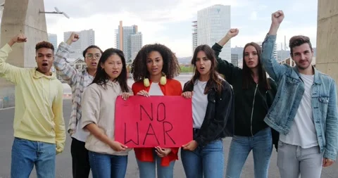 Group of diverse young people protesting against the war. Stock Footage 230284190