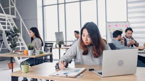 Group of diversity creative designer working at modern office building.casual Stock Photos