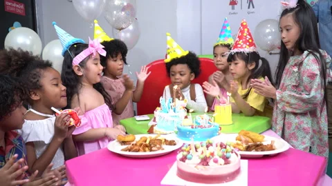 Group diversity kids celebrating clapping hands and singing birthday song to Stock Footage 145214229