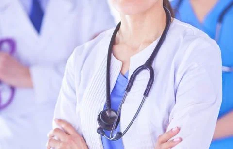 Group of doctors and nurses standing in a hospital room Stock-Fotos