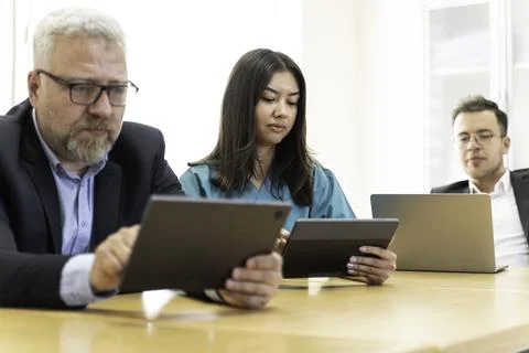 Group of doctors and nurses working together in a conference room at hospital Stock Photos