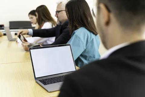 Group of doctors and nurses working together in a conference room at hospital Stock Photos
