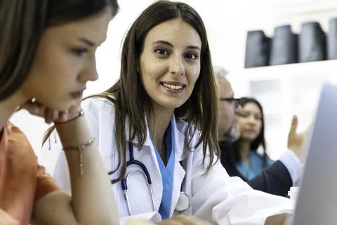 Group of doctors and nurses working together in a conference room at hospital Stock Photos