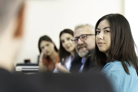 Group of doctors and nurses working together in a conference room at hospital Stock Photos