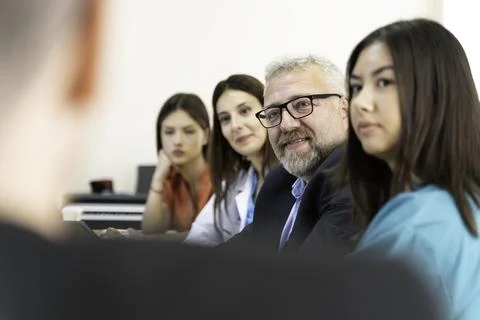 Group of doctors and nurses working together in a conference room at hospital Stock Photos