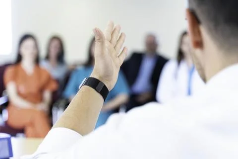 Group of doctors and nurses working together in a conference room at hospital Stock Photos
