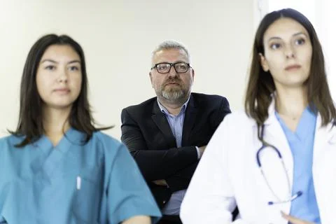Group of doctors and nurses working together in a conference room at hospital Foto stock