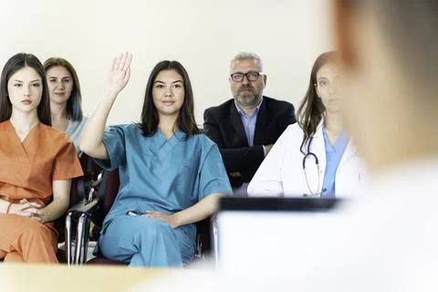 Group of doctors and nurses working together in a conference room at hospital Foto stock