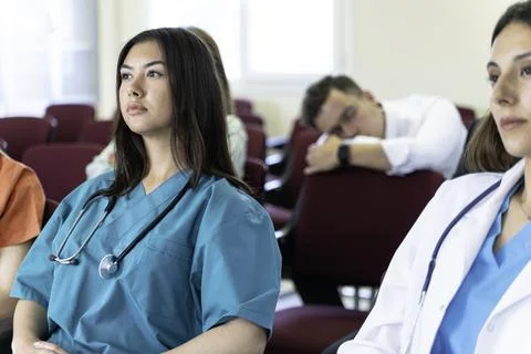 Group of doctors and nurses working together in a conference room at hospital Foto stock