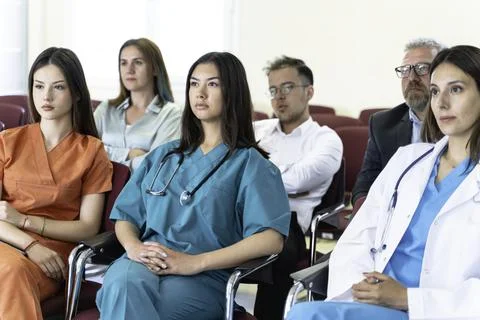 Group of doctors and nurses working together in a conference room at hospital Foto stock