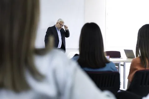 Group of doctors and nurses working together in a conference room at hospital Stock Photos