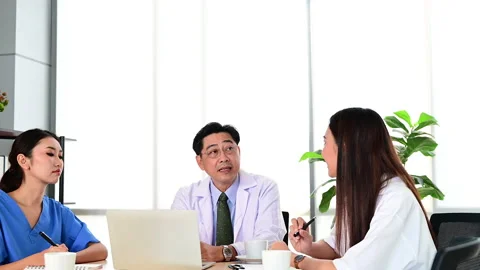 Group of doctors brainstorm meeting with computer laptop at the hospital. Stock Footage 138070638