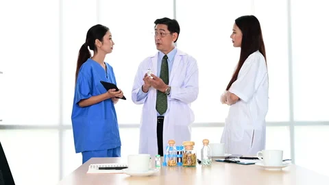 Group of doctors brainstorm meeting with computer laptop at the hospital. Stock-Footage 138070921